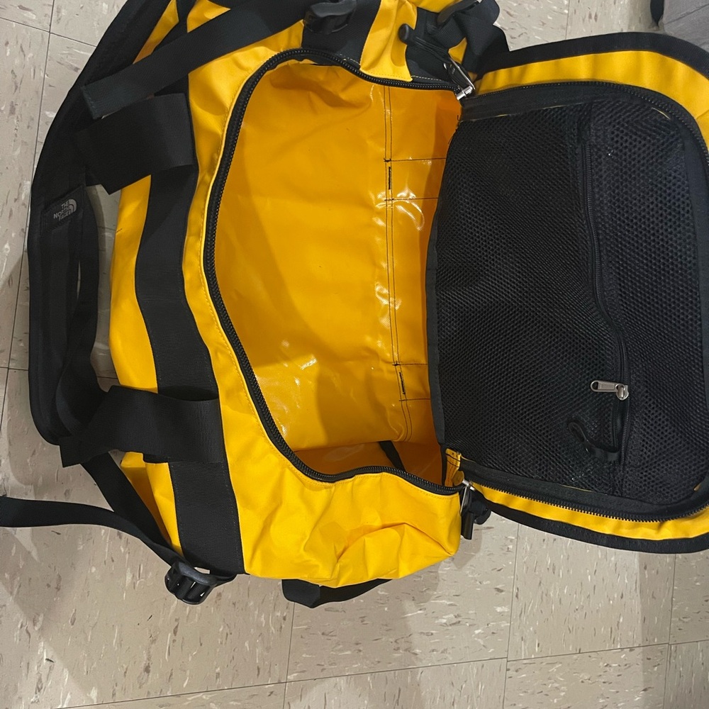 The North Face Yellow and Black Duffel Bag
